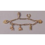 A bracelet of 9ct gold fetter and curb links hung with seven 9ct gold chains,