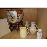 An oriental jardiniere and lacquered stand, a white and gilt Toby jug,