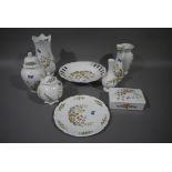 An Aynsley floral vase, two others, two jars and covers, a fruit bowl, butter dish and cover,