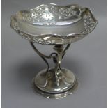 A silver sweetmeat basket of circular outline with bracketed rim and foliate pierced borders raised