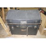 A late Victorian/Edwardian black canvas and leather trimmed domed top trunk with lift-up lid,