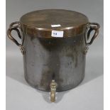 A copper cistern and cover with brass spigot