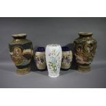 A pair of Japanese earthenware vases, decorated with Rakan and mon,