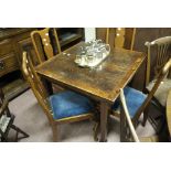 A 20th century oak draw leaf dining table on square section tapering supports;