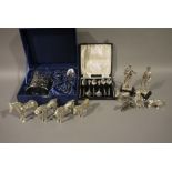 A Russian pewter tea glass and holder with spoon, cased, a set of six plated teaspoons,