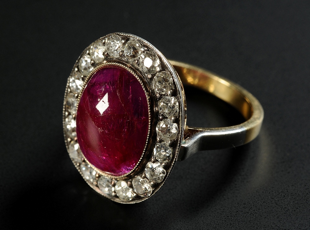 AN ART DECO RUBY AND DIAMOND CLUSTER RING, in 18ct yellow gold and silver,
