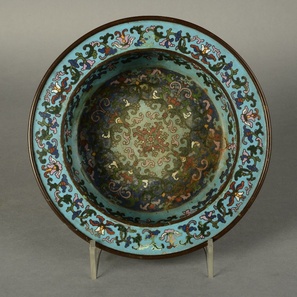 A CHINESE CHAMPLÉVE ENAMEL BRONZE SHALLOW BOWL, probably 18th century, with flat everted rim,