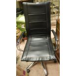 A black leatherette and chrome swivel office chair