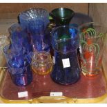 A quantity of coloured glass including a set of six blue flash glass tumblers,