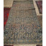 A large Persian rectangular rug,