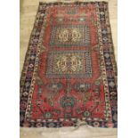 A small madder ground Caucasian rug,