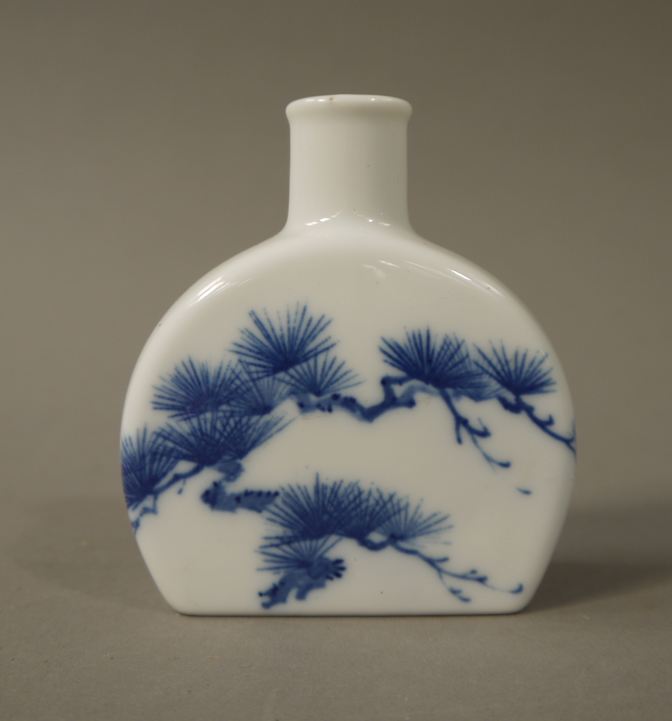 A Chinese semi-circular flask, 20th century, decorated in underglaze blue with pine branches, 9. - Image 2 of 2