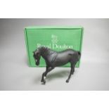 A Royal Doulton matt black glazed figure of a racehorse,