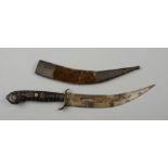 An Indian dagger having an engraved and pierced 20cm curved blade,