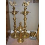 A pair of Indian heavy brass floor standing ashtrays with bird finials, another smaller,