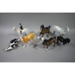 A Beswick figure of a huntswoman on a dapple grey horse, a Beswick figure of a palamino,