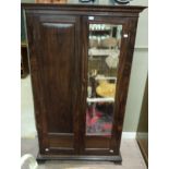 An Indian rosewood small wardrobe with single mirrored door, plain door,