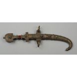 A North African tulwar with 22cm curved blade, the handle and sheath damascened and brass mounted,