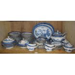 A large quantity of Booths Old Willow pattern earthenware, comprising soup tureen cover and stand,