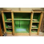 A pine open cabinet or bookcase with graduated shelves