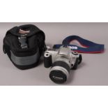 A Canon EOS 300 SLR Camera with zoom lense,