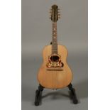 A Neapolitan College of Music flat back mandolin, with maple guitar shaped body,