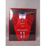 Manchester United - a signed framed Manchester United shirt by George Best and Ryan Giggs,