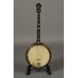 A Windsor Supremus 'The Whirle' tenor four string banjo with laminated walnut neck,