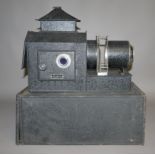 An Ensign black finish and chromed magic lantern with adjustable focus,