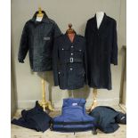 A Police tunic, two Police overcoats, a raincoat,