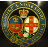 A Lancashire and Yorkshire Railway lithographed and painted insignia on a plywood board,