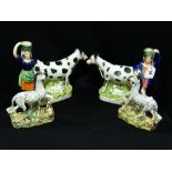 A Pair Of Staffordshire Pottery Cow And Milkmaid Creamers Together With A Pair Of Staffordshire