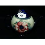 A Moorcroft Pottery Blue Ground Floral Decorated Tea Pot With Signature To The Base
