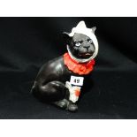 A Staffordshire Pottery Model Of A Bandaged Cat