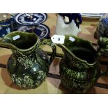 Two Green Glazed Relief Moulded Pottery Jugs