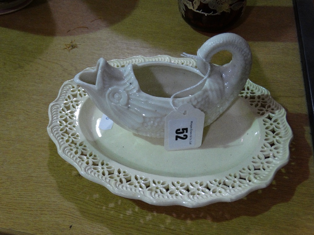 A Creamware Pierced Plate Together With A Fish Shaped Sauce Boat