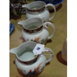 A Graduated Set Of Three Transfer Decorated Pottery Jugs