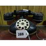 A Vintage Tin Toy Dial Telephone