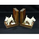 A Pair Of Cold Painted And Wooden Bookends Modeled As Terriers