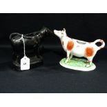 Two Staffordshire Pottery Cow Creamers