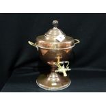 A Circular Based Copper And Brass Urn