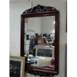 A Mahogany Framed Wall Mirror With Carved Applique