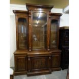 A 19th Century Mahogany Break Front Bookcase, The Upper Portion Having Three Glazed Doors, The
