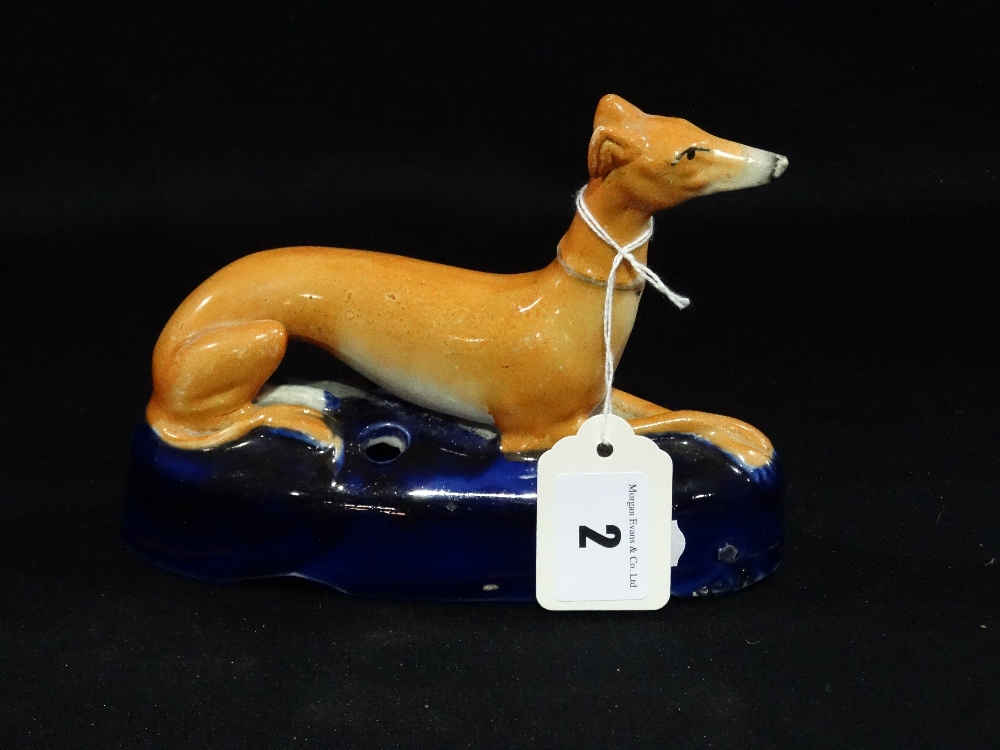 A Staffordshire Pottery Greyhound Pen Holder On A Blue Cushion Base