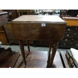 A 19th Century Mahogany Drop Leaf Work Table On Turned Supports