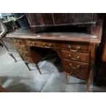 An Edwardian Period Leather Topped Knee Hole Desk On Turned Supports