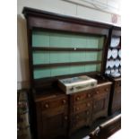 An Antique Oak And Mahogany Anglesey Dresser Having A Three Shelf Rack With Diamond And Dot