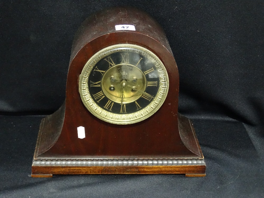 A Polished Mahogany Encased Mantel Clock With Circular Dial