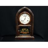An American Chiming Arched Bracket Clock With Armorial Glass Panel