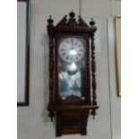 A 19th Century Pendulum Wall Clock With Circular Dial